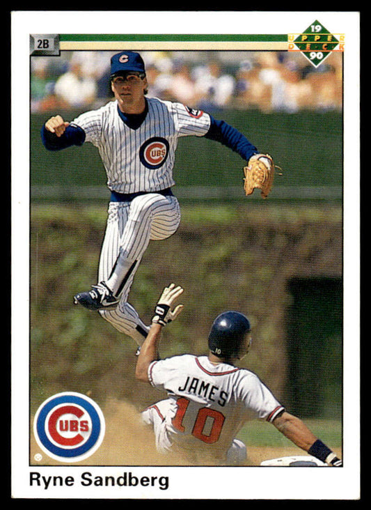 Chicago Cubs infielder Ryne Sandberg leaps over a baserunner in an action shot