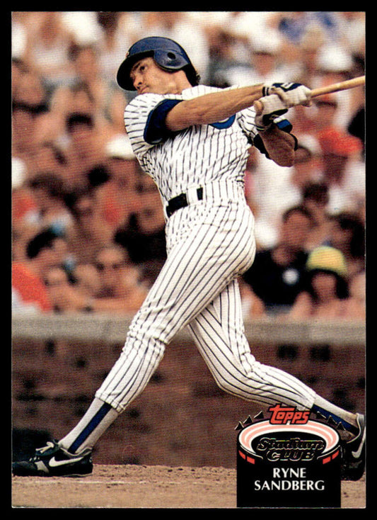 Baseball card featuring Ryne Sandberg swinging in Chicago Cubs uniform