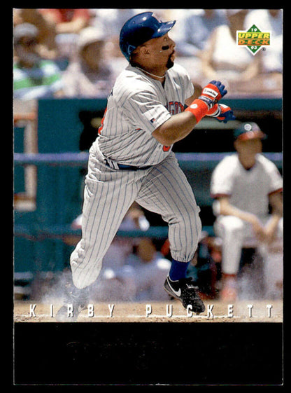 Baseball player in Minnesota Twins uniform swinging bat on R17 Kirby Puckett baseball card