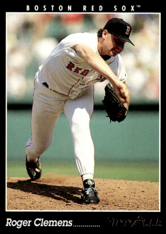 Boston Red Sox pitcher Roger Clemens in mid-delivery wearing a white uniform