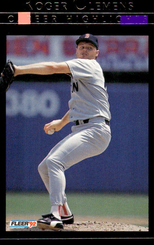 Baseball pitcher Roger Clemens in white uniform delivering on mound for Boston Red Sox