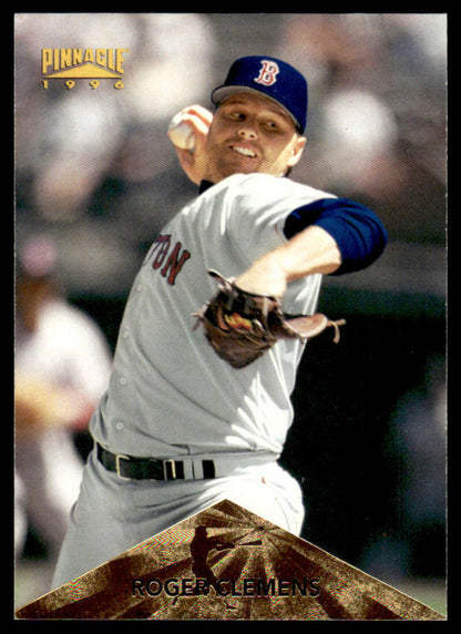 Boston Red Sox pitcher Roger Clemens in mid-throw wearing a white and blue uniform