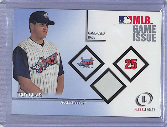 Baseball card of Troy Glaus featuring Anaheim Angels pinstriped uniform and Fleer Legacy base material