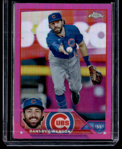 Pink-bordered Chicago Cubs baseball card of Dansby Swanson fielding a baseball