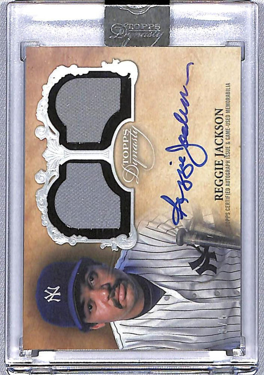 Reggie Jackson Topps Dynasty Dual Relic baseball card with blue autograph and jersey patches