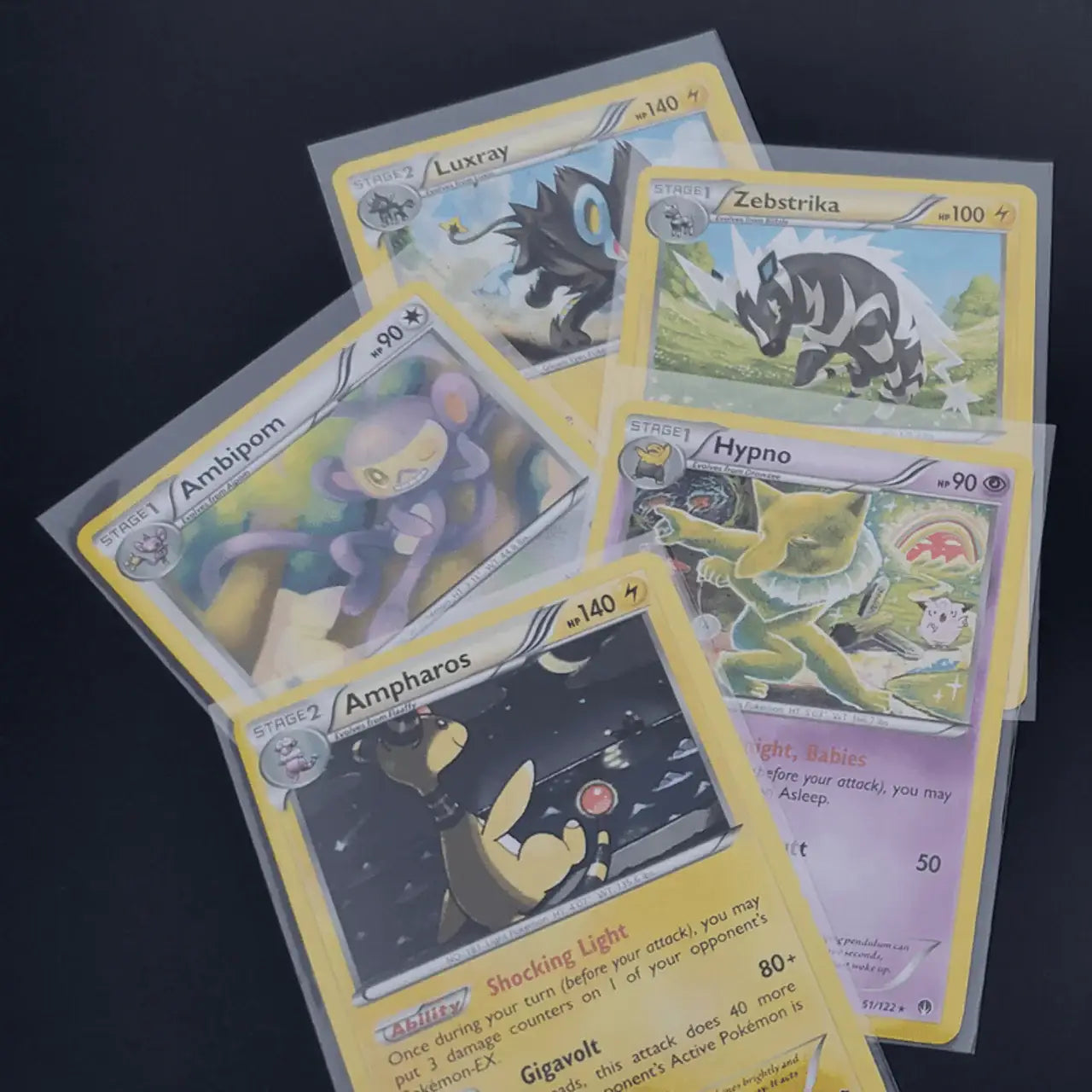 Collection of Pokémon trading cards protected in Max Pro card sleeves for trading cards