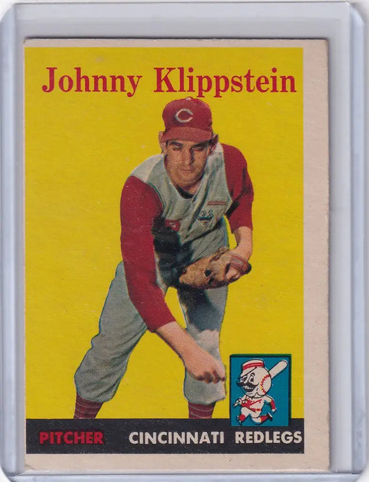 Vintage 1958 Topps Johnny Klippstein Cincinnati Reds baseball card in throwing stance