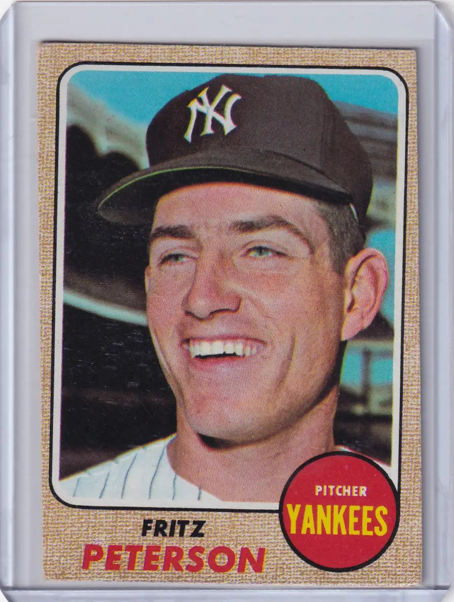 Baseball card of Fritz Peterson, smiling Yankees pitcher, 1968 Topps Baseball collectible