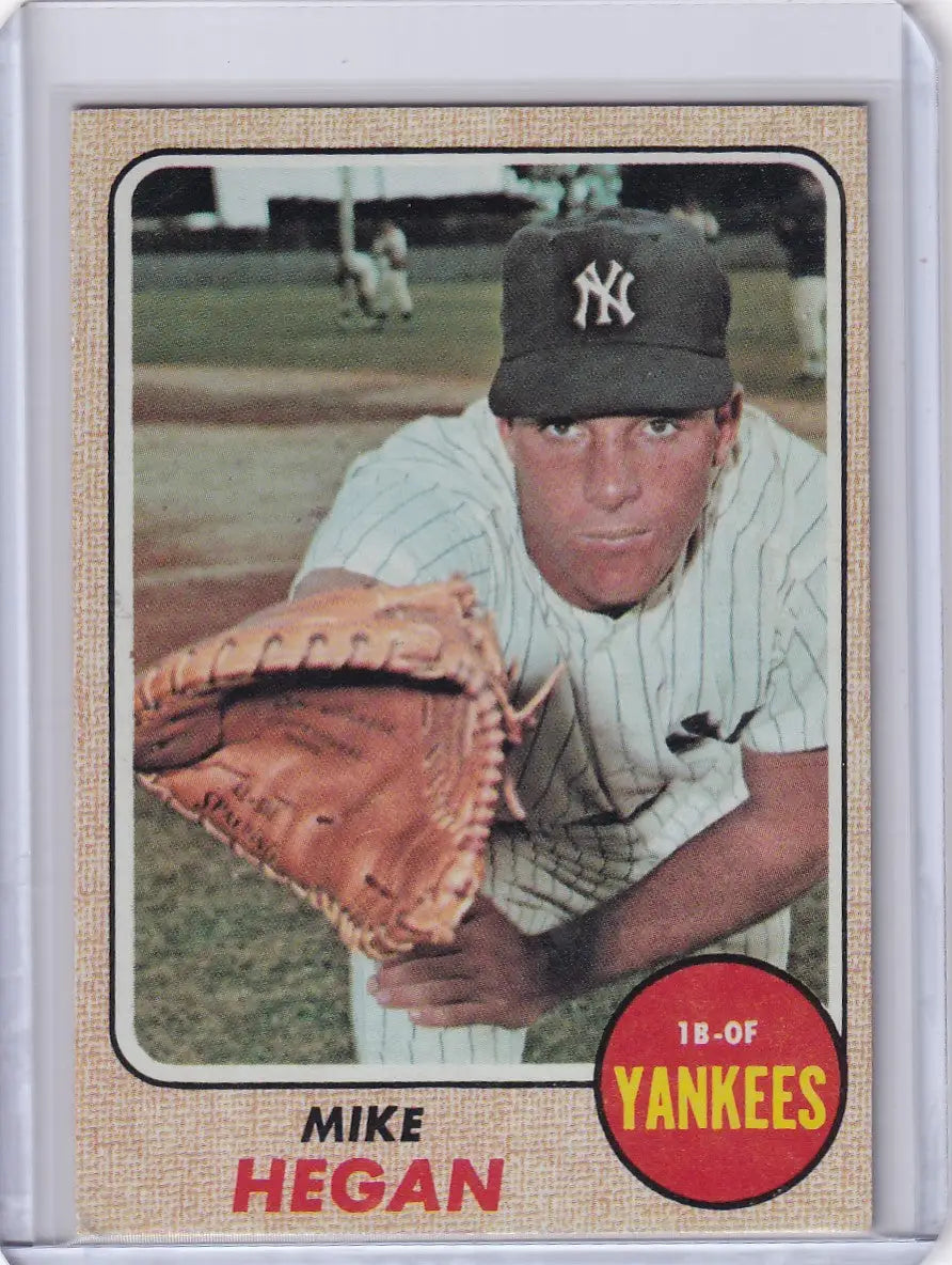 Baseball card of Mike Hegan in pitching pose for Topps Baseball New York Yankees