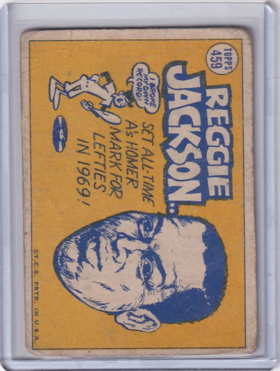 Vintage Topps Baseball card of Reggie Jackson, Oakland Athletics, on yellow background