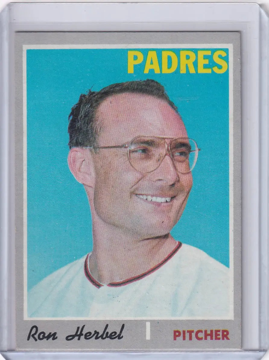 Baseball card of Ron Herbel, smiling pitcher for San Diego Padres in white uniform