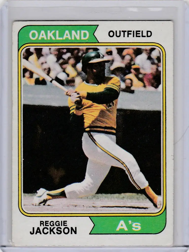 1974 Topps Baseball #130 Reggie Jackson Oakland Athletics EXMT card mid-swing action