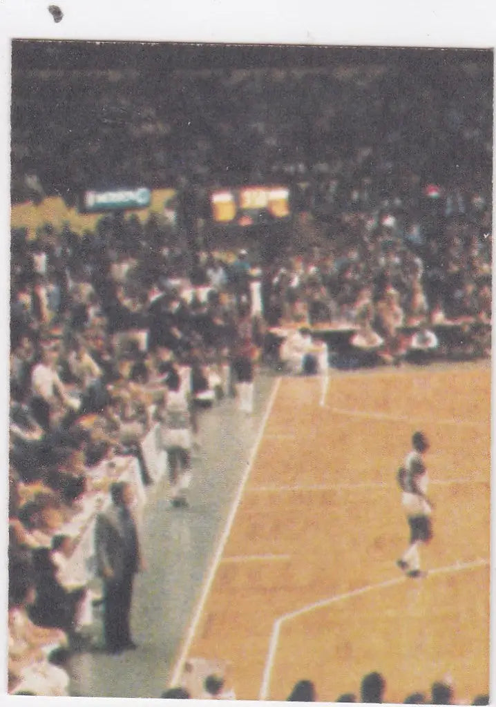 Basketball player in action with crowded arena, featured in 1980-81 Fleer NBA Basketball Sticker