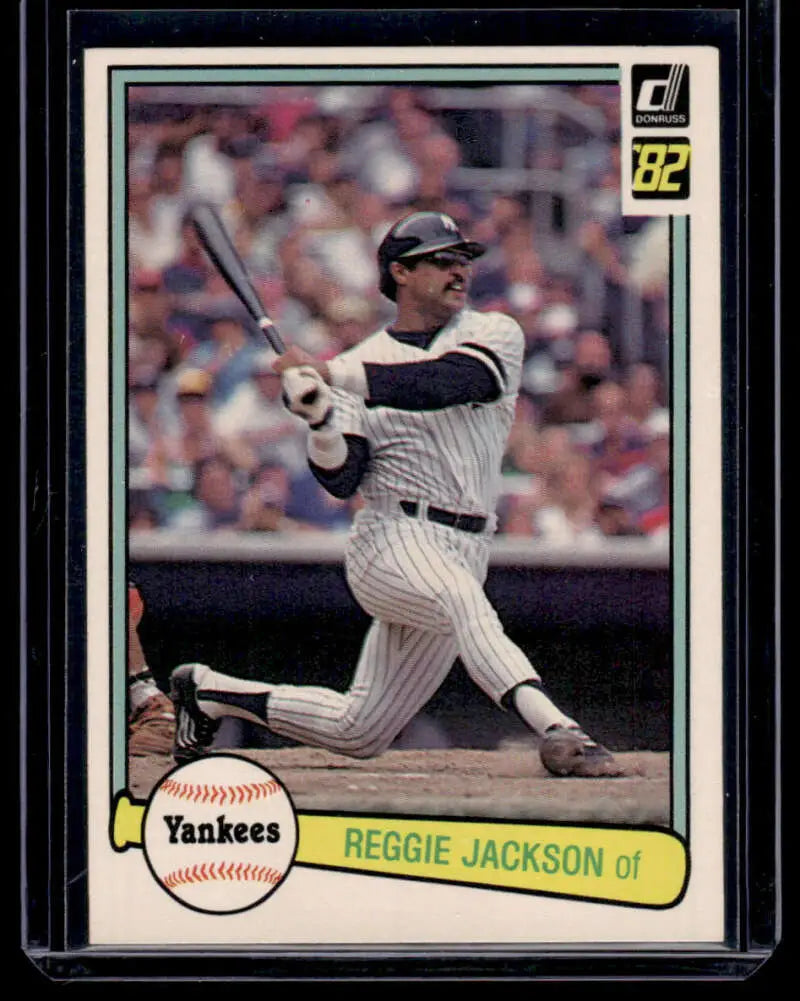 Reggie Jackson mid-swing on an excellent card featuring New York Yankees pinstripes