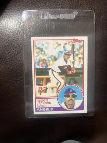 Reggie Jackson baseball card in protective case from 1983 Topps trading cards