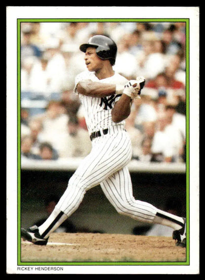 Rickey Henderson swinging bat in New York Yankees pinstripe uniform baseball card