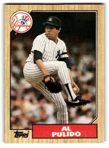 Baseball card featuring New York Yankees pitcher in pinstripe uniform mid-delivery