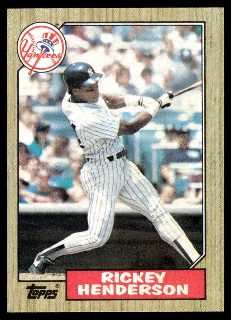 Baseball card of Rickey Henderson in pinstripes for New York Yankees mid-swing