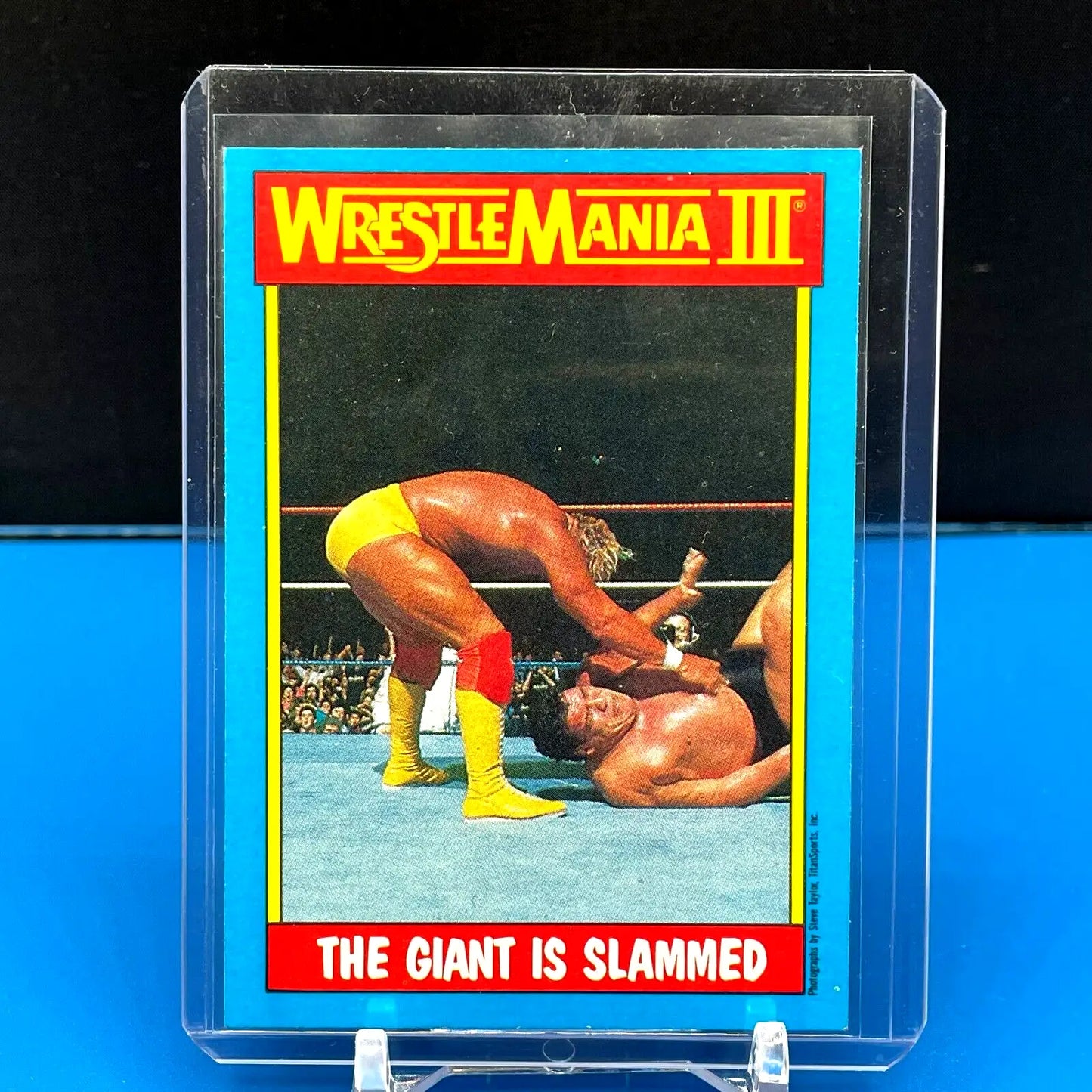 Wrestling trading card featuring Hulk Hogan slamming Andre the Giant from Topps WWF