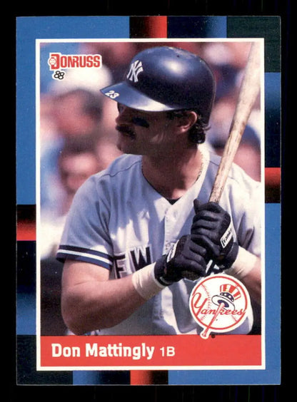 Don Mattingly in white New York Yankees uniform with bat on 1988 Donruss baseball card