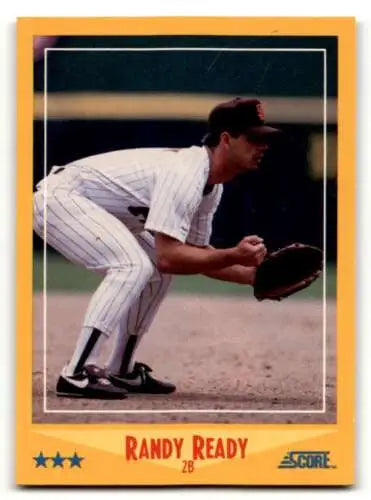 Baseball player Randy Ready San Diego crouched in pinstriped uniform with glove