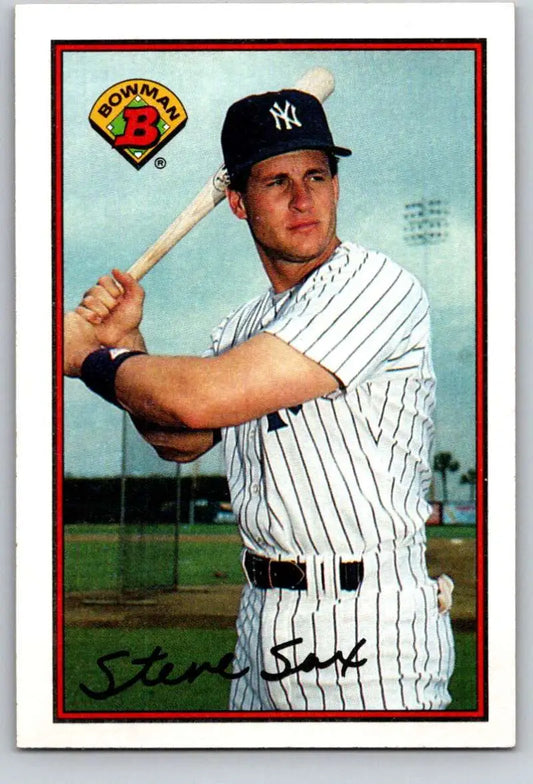 Steve Sax in New York Yankees pinstripe uniform holding a bat baseball card