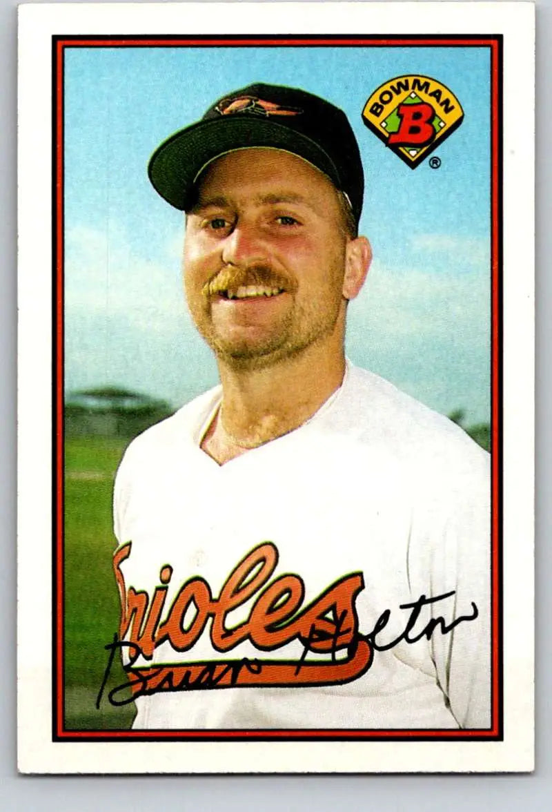 Baseball card of Brian Holton in white Orioles jersey and black cap