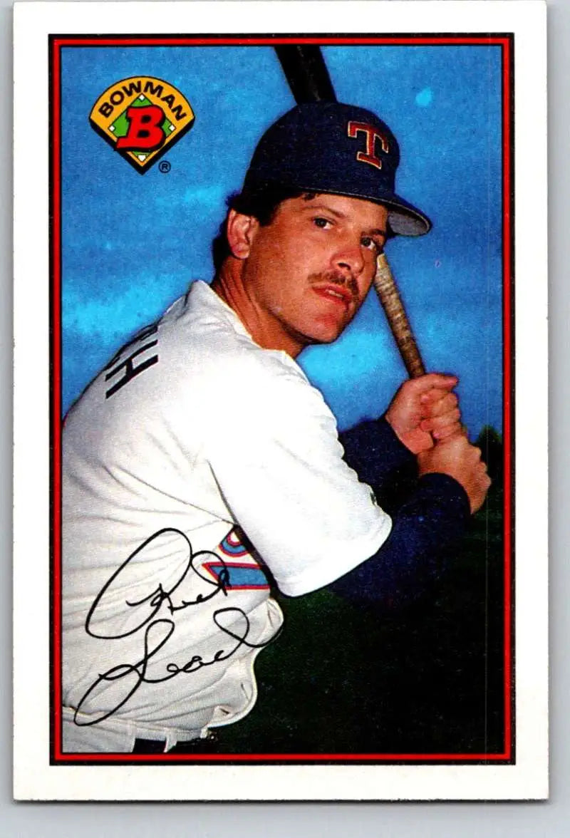 Baseball player Rick Leach in Texas Rangers uniform holding bat in batting stance