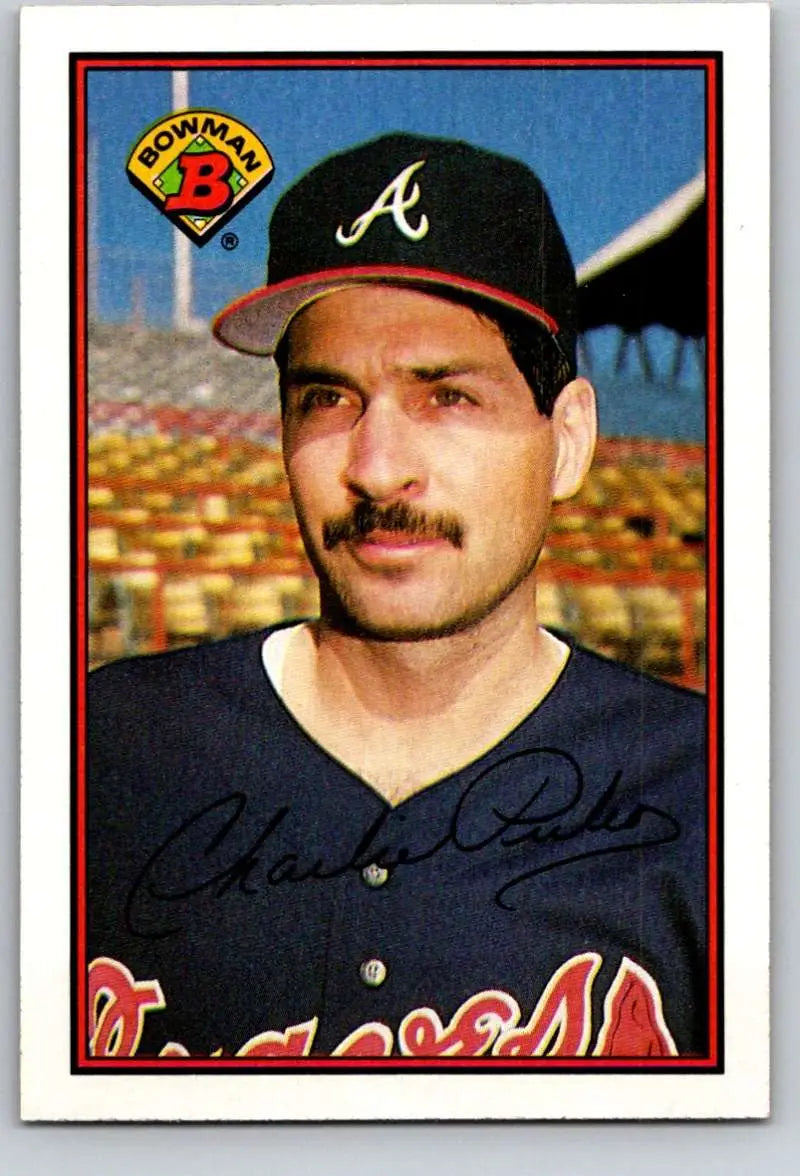 Baseball card of Charlie Puleo in navy Atlanta Braves uniform and cap with mustache