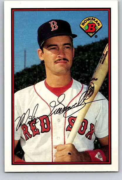 Baseball card of Mike Greenwell in Boston Red Sox home uniform with bat