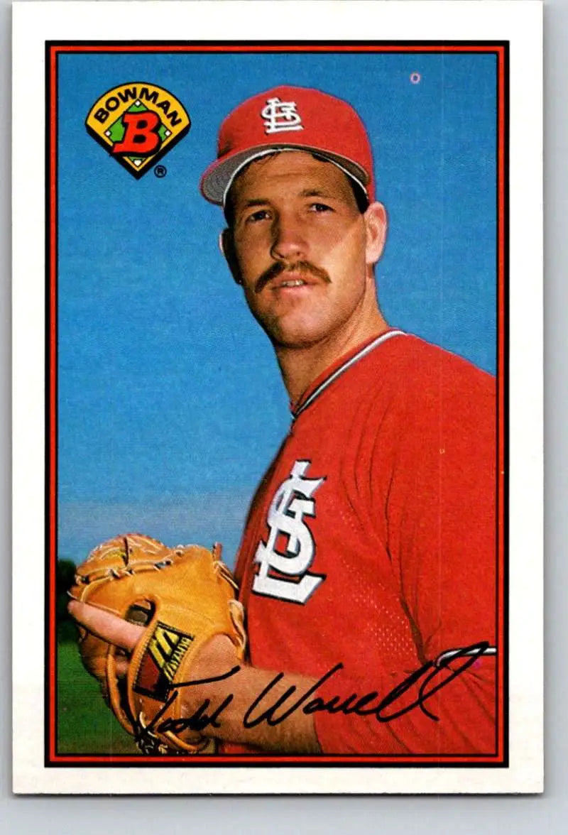 Baseball card of Todd Worrell in red uniform with tan glove for St. Louis Cardinals