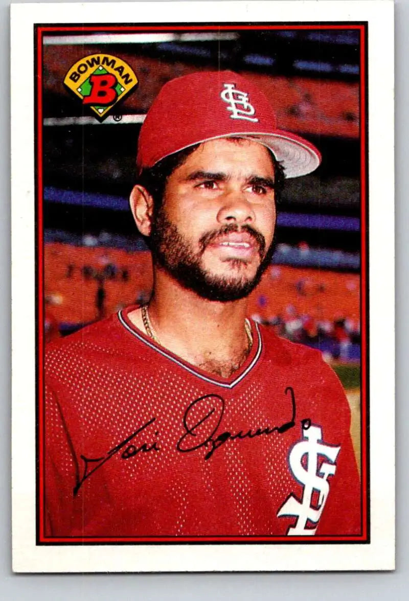 Baseball card of Jose Oquendo in red uniform with STL logo for St. Louis Cardinals