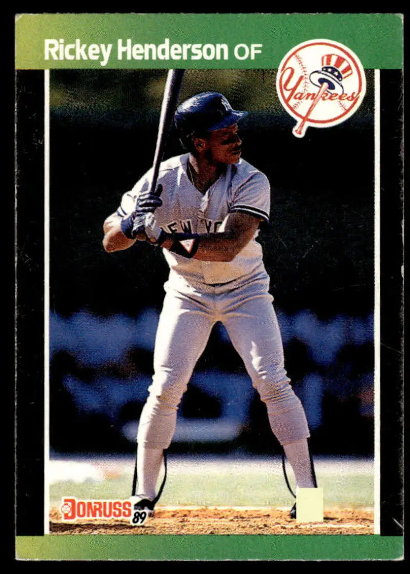 Baseball card of Rickey Henderson in Yankees uniform, batting stance from 1989 Donruss