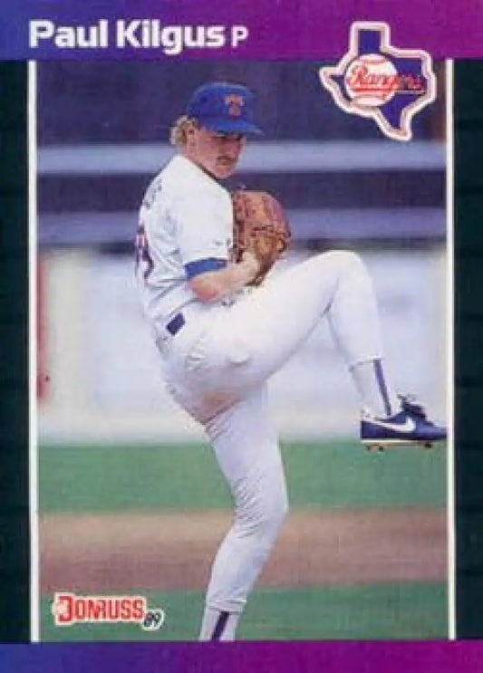 Baseball player Paul Kilgus in white uniform pitching for Texas Rangers Baseball