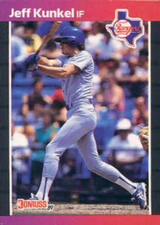 Baseball player Jeff Kunkel in blue uniform swinging bat for Texas Rangers baseball card