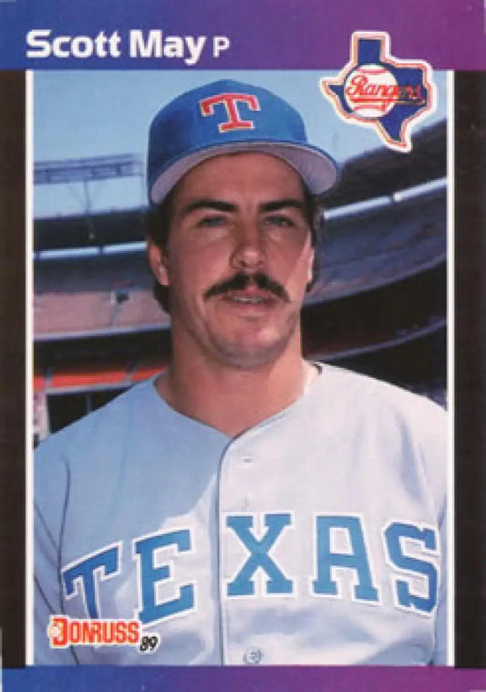 Baseball card of a Rookie Texas Rangers player in white uniform and blue cap