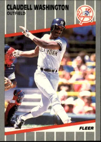 Baseball card of Claudell Washington swinging bat in Yankees pinstriped uniform