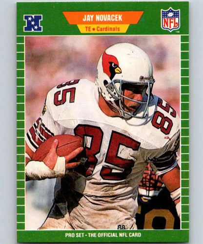 Jay Novacek rookie football card in white uniform for Phoenix Cardinals carrying ball