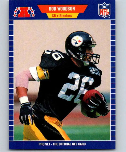 Rod Woodson carrying the ball in black and gold uniform, Pittsburgh Steelers football card