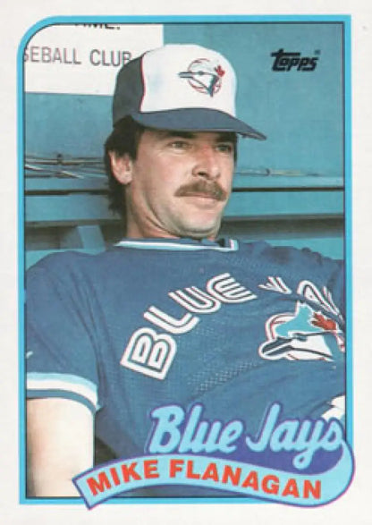 Vintage 1989 Topps Mike Flanagan baseball card of Toronto Blue Jays player in blue uniform