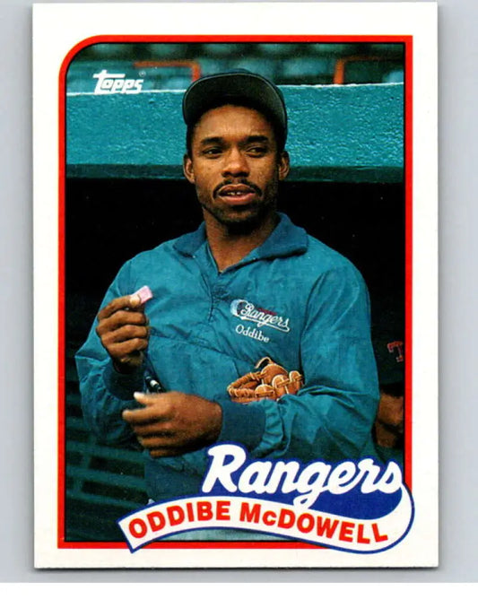 Baseball card of Oddibe McDowell in a teal Texas Rangers jacket