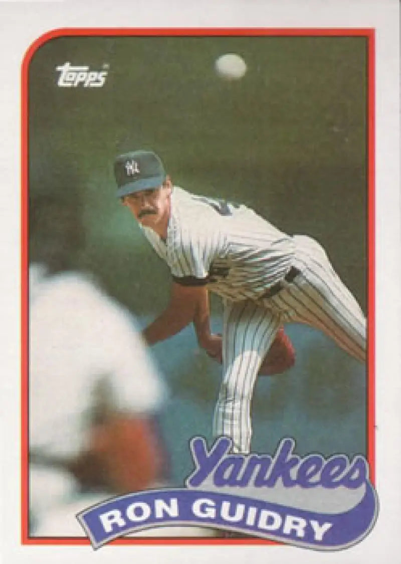 Baseball card of Ron Guidry in pinstripes, New York Yankees pitcher mid-throw