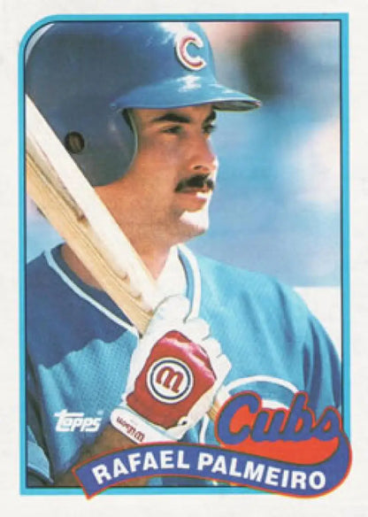 Chicago Cubs baseball card featuring Rafael Palmeiro in blue uniform holding bat