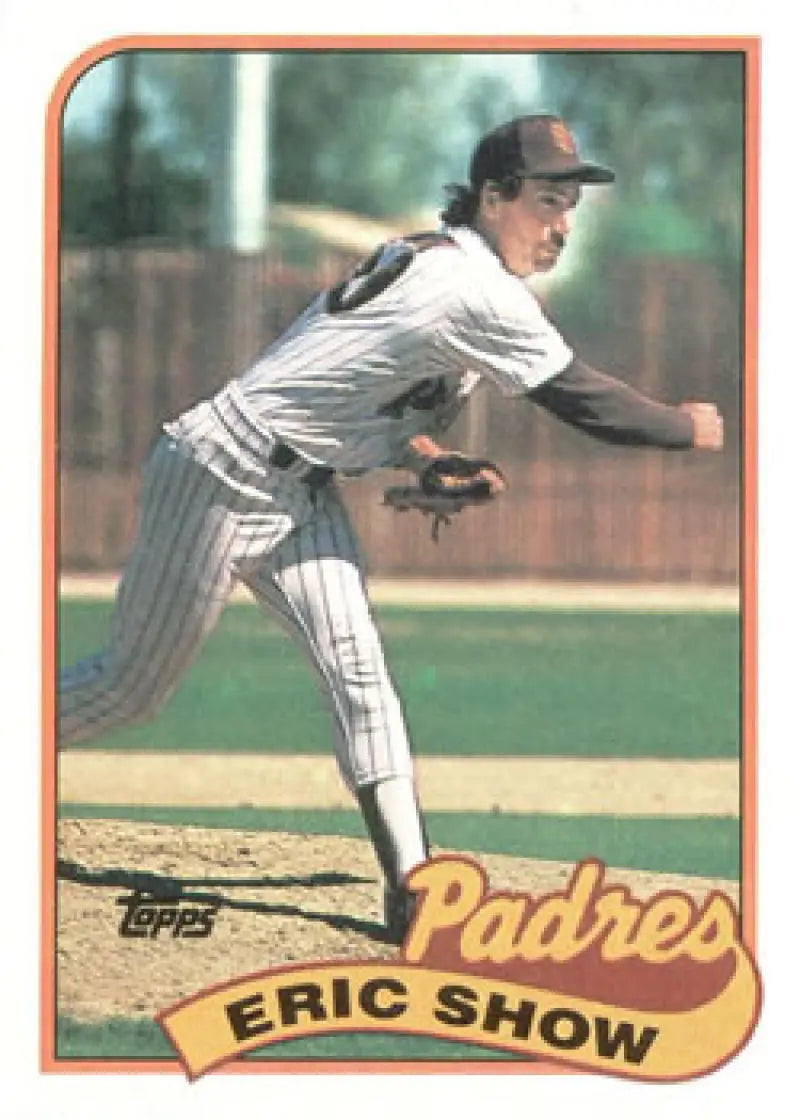 Baseball player in San Diego Padres pinstriped uniform mid-pitch action shot