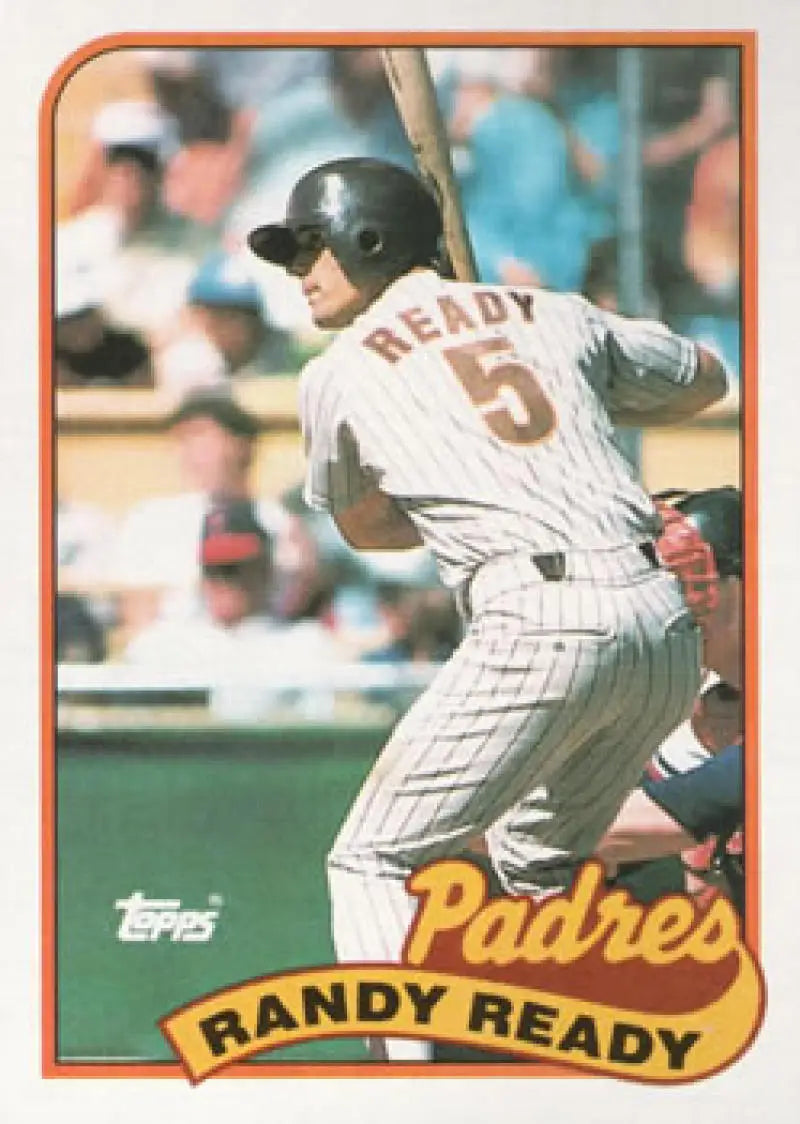 Baseball card of Randy Ready in white pinstriped uniform for San Diego Padres at bat