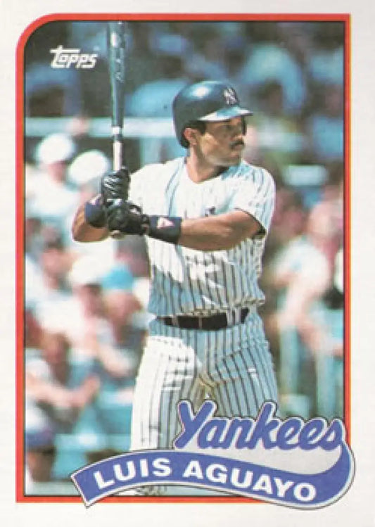 1989 Topps Luis Aguayo baseball card of New York Yankees player in pinstripes batting