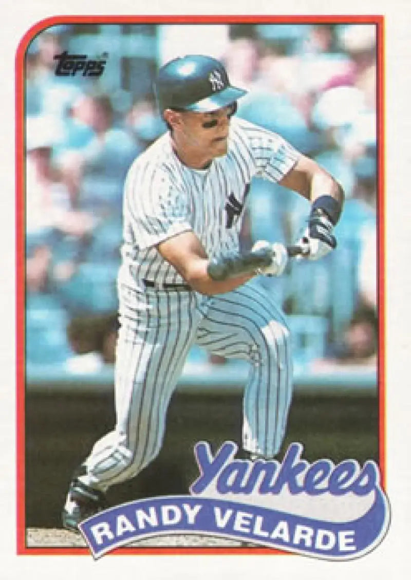 Randy Velarde UER New York Yankees player in pinstriped uniform preparing to bunt