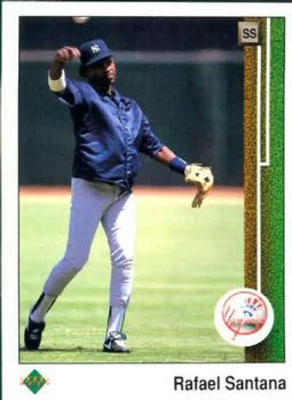 Baseball player in New York Yankees uniform throwing ball on Upper Deck Rafael Santana card