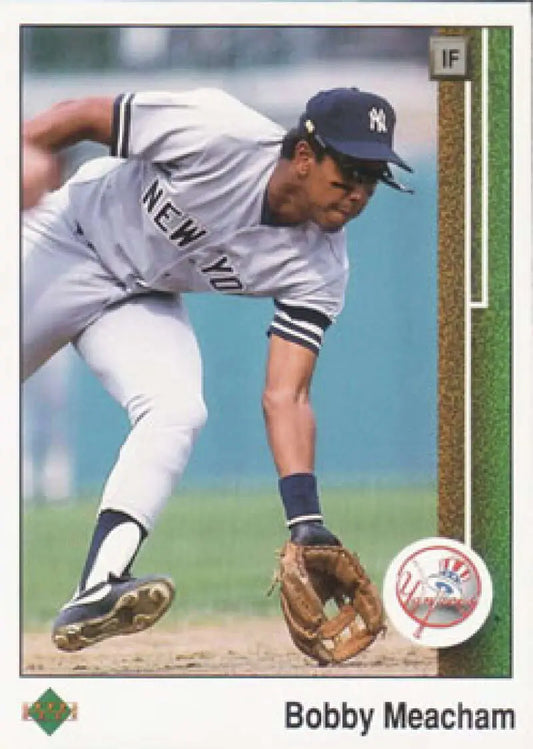 Bobby Meacham fielding a ground ball in New York Yankees uniform on baseball card