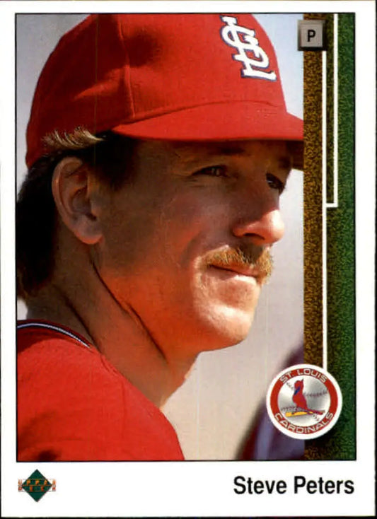 Baseball card of Steve Peters from the St. Louis Cardinals in a red cap